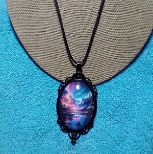 Black cabochon necklace large pendant aurora borealis ignore reflection in pics.